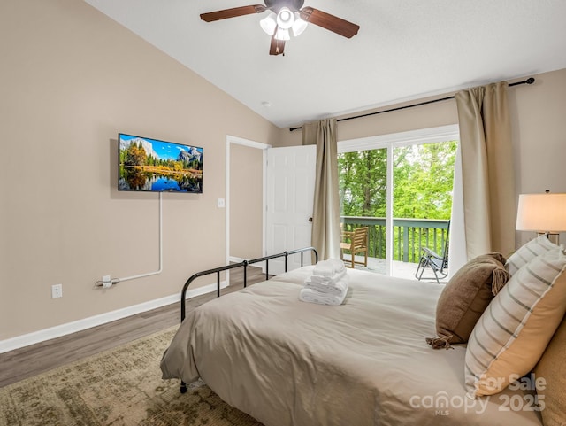 bedroom with access to exterior, vaulted ceiling, wood finished floors, baseboards, and ceiling fan