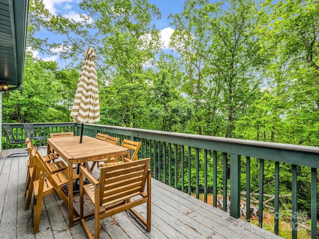 deck with outdoor dining area