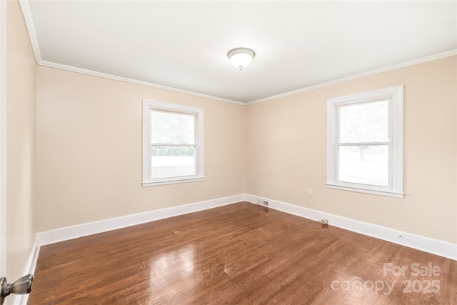 104 Willetta Dr, Charlotte, NC 28217 - spare room with crown molding, wood finished floors, and baseboards