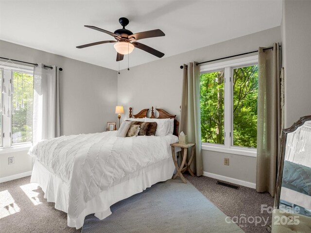 bedroom featuring carpet floors, baseboards, and ceiling fan