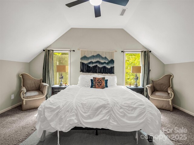 carpeted bedroom with multiple windows, lofted ceiling, a ceiling fan, and baseboards