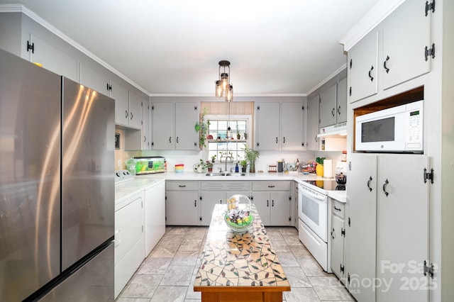 1115 Grovewood Dr, Charlotte, NC 28208 - kitchen with white appliances, washer and dryer, under cabinet range hood, a sink, and light countertops