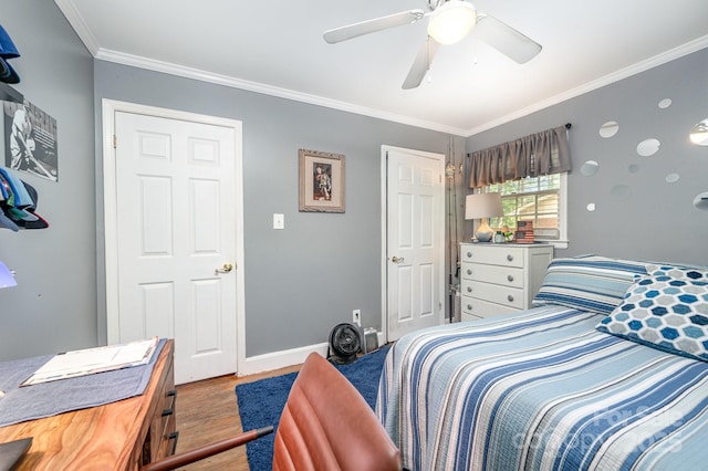 1115 Grovewood Dr, Charlotte, NC 28208 - bedroom with wood finished floors, crown molding, baseboards, and ceiling fan