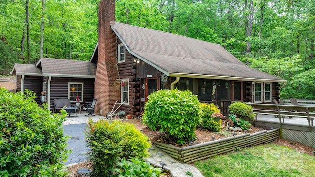 3763 Laurel Heights Dr, Morganton, NC 28655 - log home featuring log siding, a chimney, a patio, a sunroom, and a deck