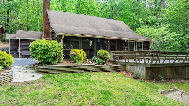 3763 Laurel Heights Dr, Morganton, NC 28655 - back of house featuring a yard, a deck, a sunroom, log siding, and a chimney