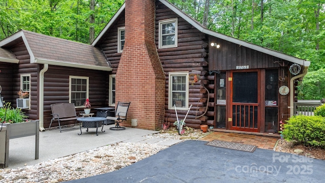 3763 Laurel Heights Dr, Morganton, NC 28655 - rear view of house with log siding, a chimney, a patio, and cooling unit