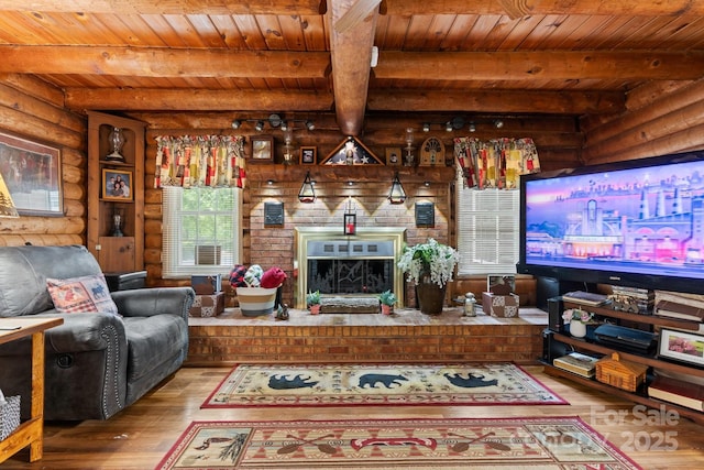3763 Laurel Heights Dr, Morganton, NC 28655 - living area featuring rustic walls, wood-type flooring, wood ceiling, a brick fireplace, and beam ceiling
