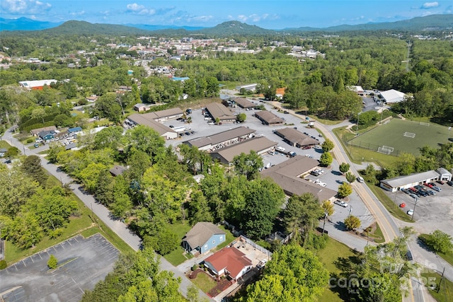 view of property location with a mountain backdrop and nearby suburban area