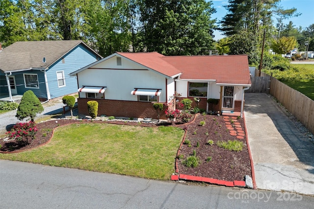 view of front facade with concrete driveway and brick siding