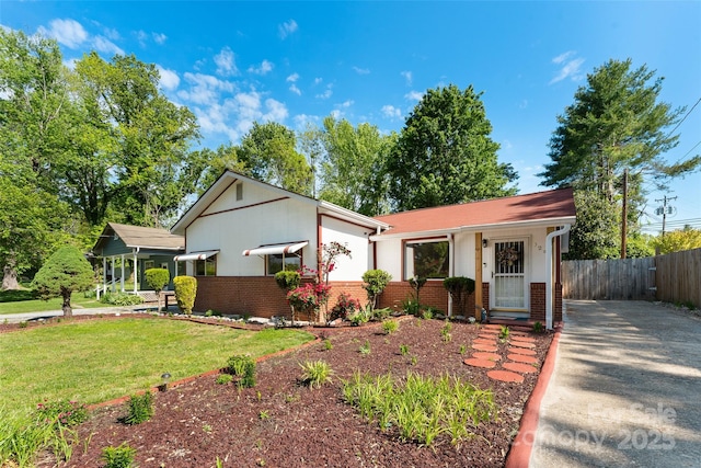 view of front of property with brick siding and driveway