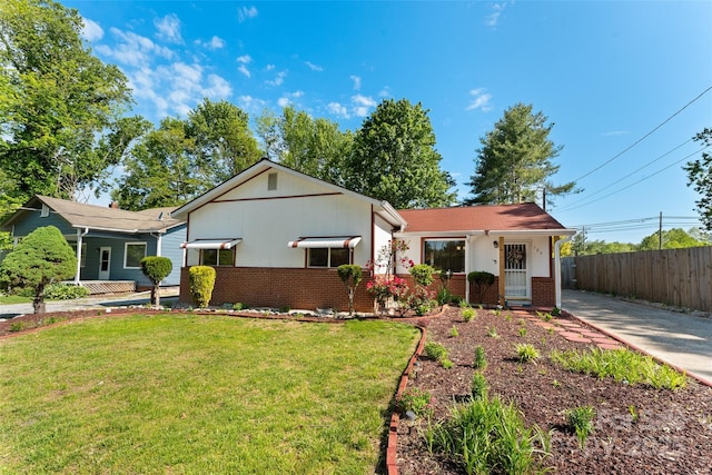 view of front of home with brick siding and concrete driveway