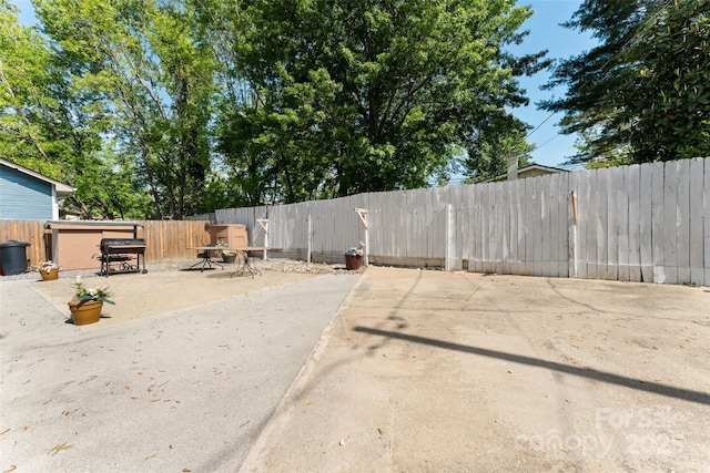 fenced backyard with a patio