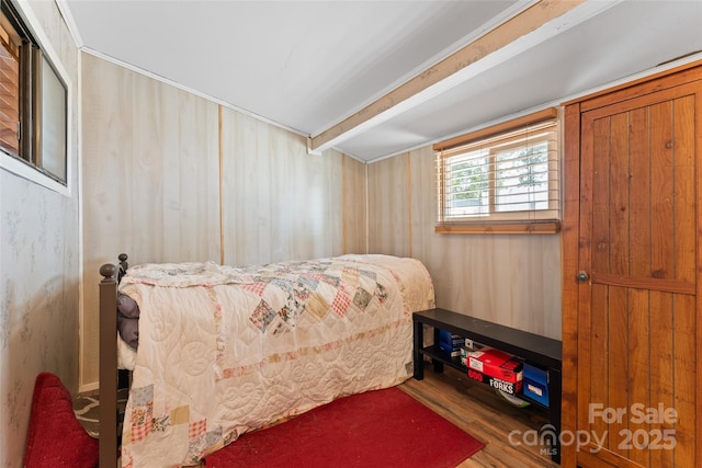 bedroom with wood finished floors