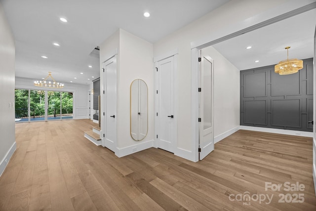 1408 Bloomsberry Ln, Waxhaw, NC 28173 - corridor featuring a chandelier, light wood-type flooring, baseboards, and recessed lighting