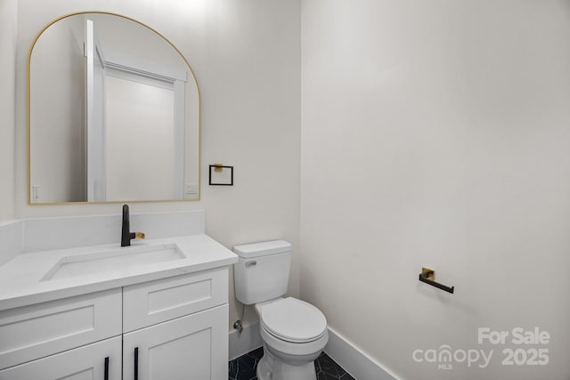 1408 Bloomsberry Ln, Waxhaw, NC 28173 - half bathroom featuring toilet, vanity, tile patterned flooring, and baseboards