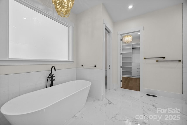 1408 Bloomsberry Ln, Waxhaw, NC 28173 - full bath with a chandelier, marble tiled flooring, a walk in closet, a freestanding bath, and recessed lighting