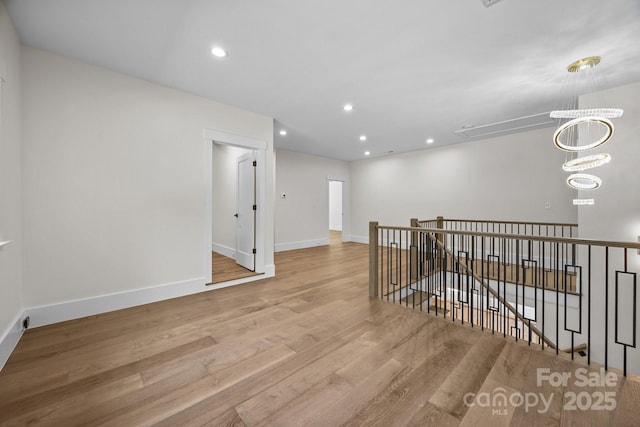 1408 Bloomsberry Ln, Waxhaw, NC 28173 - empty room featuring wood finished floors, baseboards, attic access, and recessed lighting