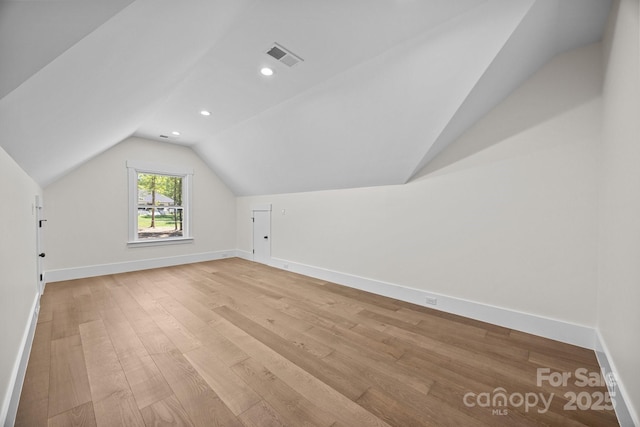 1408 Bloomsberry Ln, Waxhaw, NC 28173 - bonus room with vaulted ceiling, light wood-style floors, baseboards, and recessed lighting