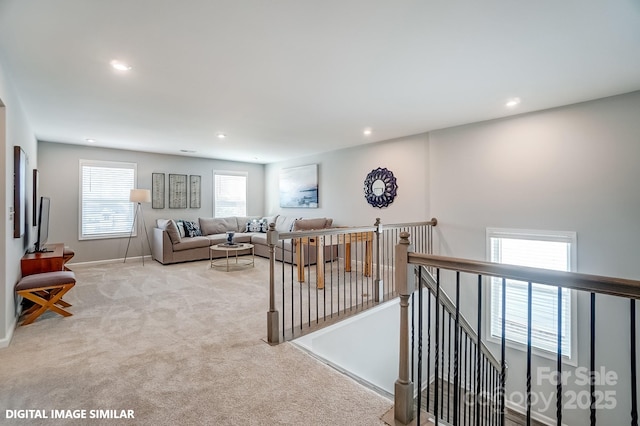 living area featuring carpet, recessed lighting, and baseboards