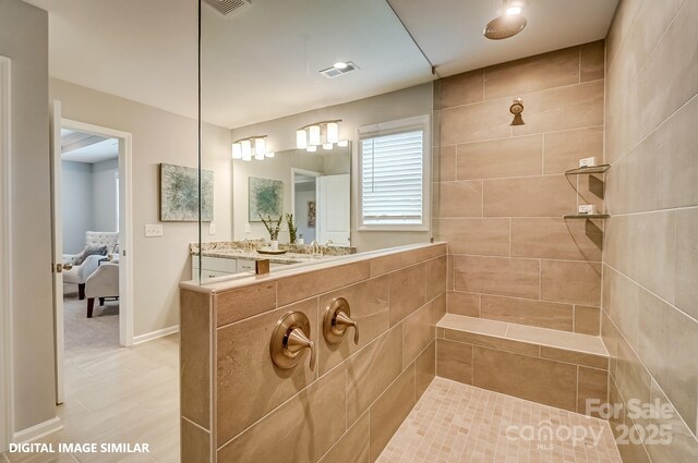 bathroom with walk in shower and ensuite bath