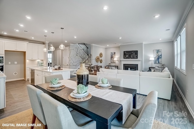 9945 Cask Way, Huntersville, NC 28078 - dining area featuring light wood finished floors, recessed lighting, baseboards, and plenty of natural light