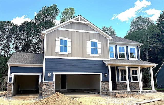 9945 Cask Way, Huntersville, NC 28078 - craftsman house with covered porch, stone siding, board and batten siding, and an attached garage