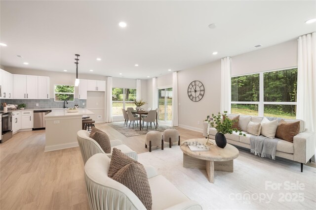 515 Dixie Dr, Mooresville, NC 28115 - living area featuring light wood-type flooring and recessed lighting