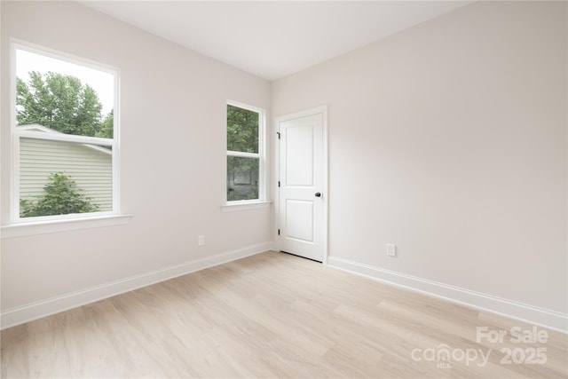 515 Dixie Dr, Mooresville, NC 28115 - spare room with light wood finished floors and healthy amount of natural light