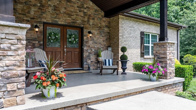 4616 Gold Finch Dr, Denver, NC 28037 - view of exterior entry featuring stone siding and french doors