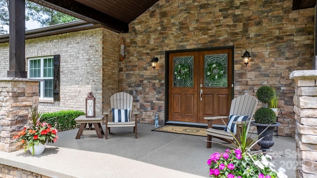 4616 Gold Finch Dr, Denver, NC 28037 - view of exterior entry with french doors and stone siding