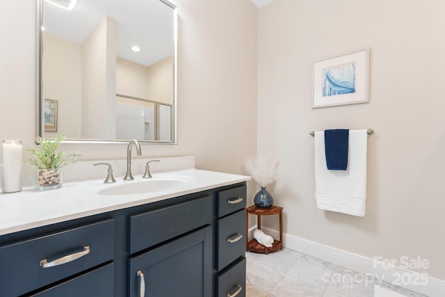 4616 Gold Finch Dr, Denver, NC 28037 - bathroom featuring marble look tile flooring, vanity, and baseboards
