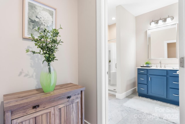 4616 Gold Finch Dr, Denver, NC 28037 - bathroom with vanity, baseboards, and marble look tiles