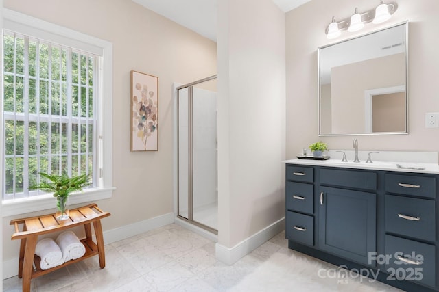 4616 Gold Finch Dr, Denver, NC 28037 - bathroom featuring baseboards, a stall shower, vanity, and marble look tile flooring
