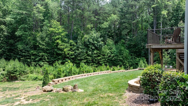 4616 Gold Finch Dr, Denver, NC 28037 - view of grassy yard featuring a view of trees and a deck