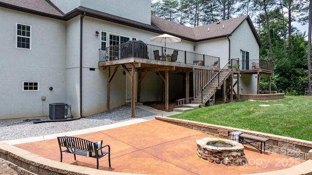 4616 Gold Finch Dr, Denver, NC 28037 - back of house with an outdoor fire pit, a patio area, a wooden deck, and stucco siding