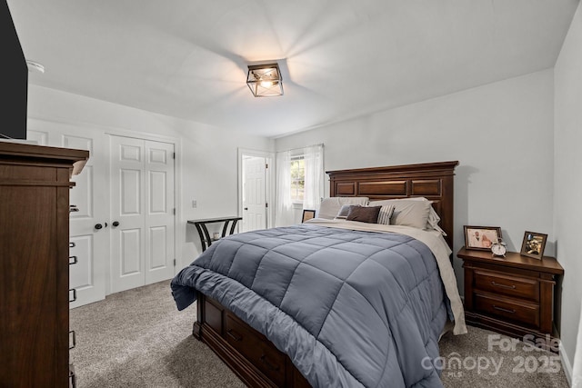 carpeted bedroom with a closet