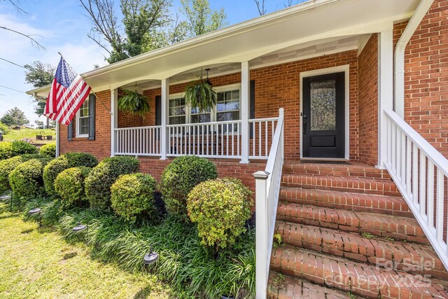 2076 Junction Rd, Mocksville, NC 27028 - property entrance with brick siding and covered porch