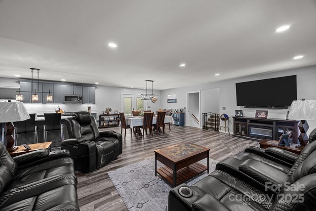 2076 Junction Rd, Mocksville, NC 27028 - living area featuring recessed lighting, wood finished floors, and a chandelier