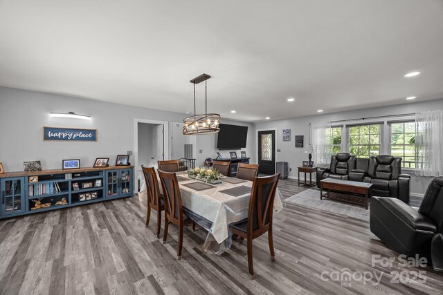 2076 Junction Rd, Mocksville, NC 27028 - dining space featuring recessed lighting, wood finished floors, a chandelier, and baseboards