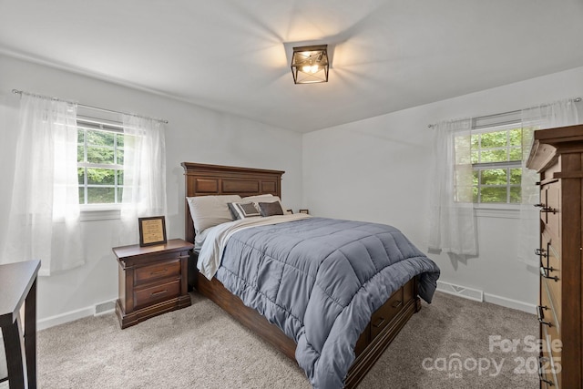 2076 Junction Rd, Mocksville, NC 27028 - bedroom featuring baseboards and light carpet