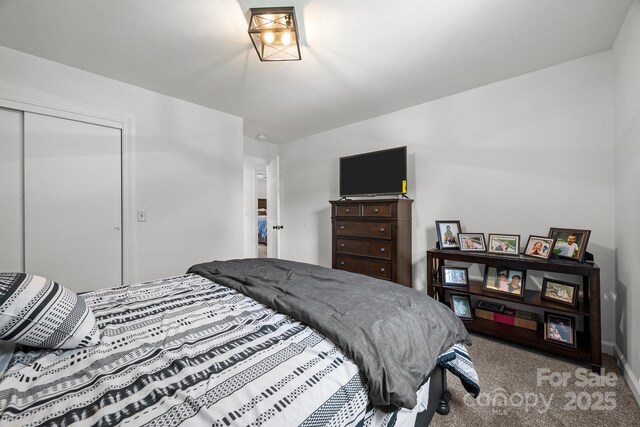 2076 Junction Rd, Mocksville, NC 27028 - carpeted bedroom featuring a closet and baseboards