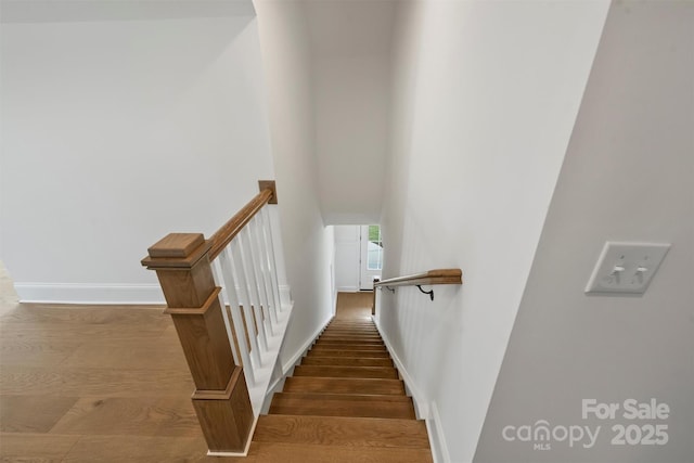 13605 Tranquil Day Dr, Matthews, NC 28105 - stairs with baseboards, wood finished floors, and a towering ceiling
