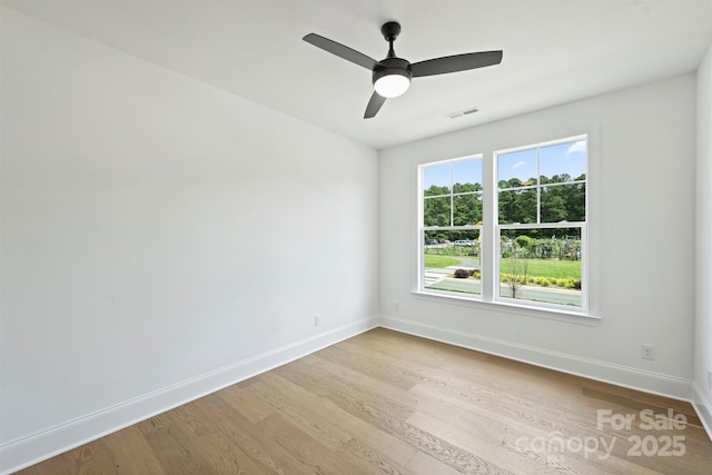 13605 Tranquil Day Dr, Matthews, NC 28105 - spare room featuring wood finished floors and a ceiling fan