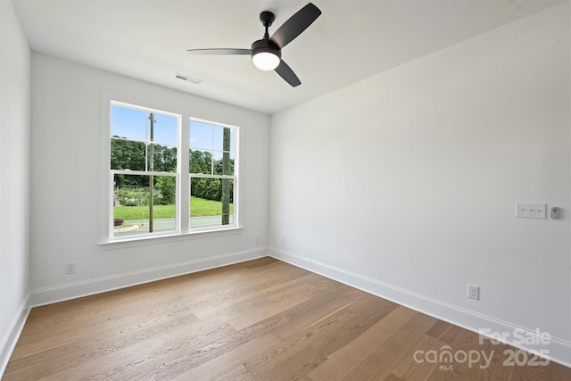 13605 Tranquil Day Dr, Matthews, NC 28105 - unfurnished room featuring wood finished floors and a ceiling fan