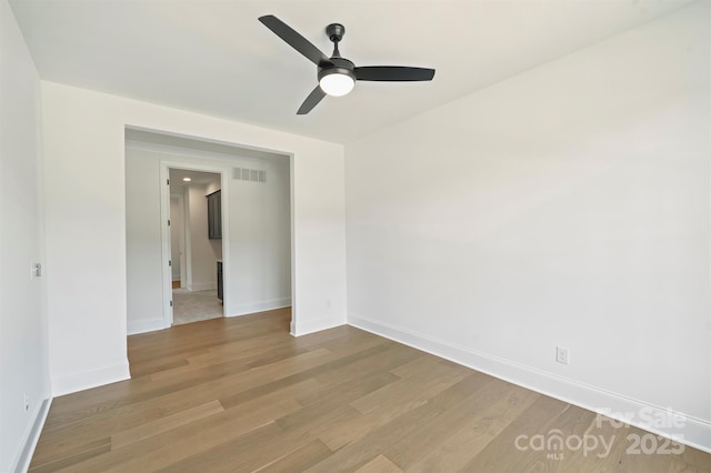 13605 Tranquil Day Dr, Matthews, NC 28105 - unfurnished room featuring wood finished floors and a ceiling fan