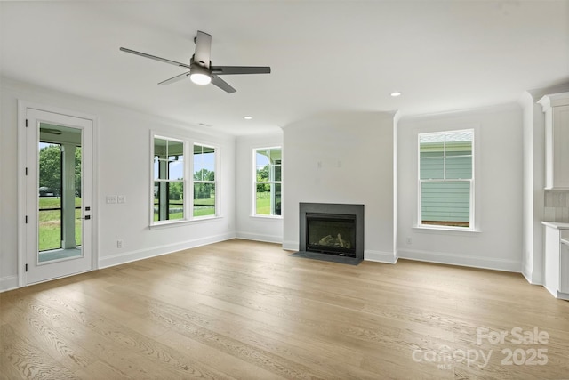 13605 Tranquil Day Dr, Matthews, NC 28105 - unfurnished living room with a fireplace with flush hearth, a ceiling fan, light wood finished floors, and recessed lighting