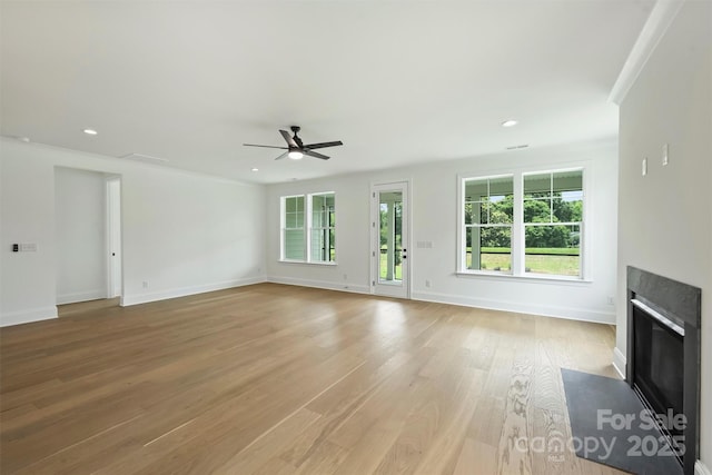 13605 Tranquil Day Dr, Matthews, NC 28105 - unfurnished living room with a ceiling fan, a fireplace with flush hearth, light wood finished floors, and recessed lighting
