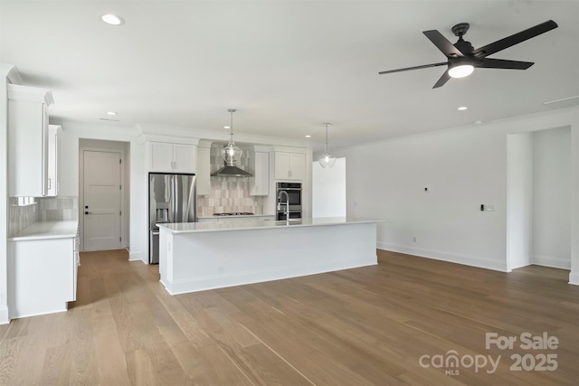 13605 Tranquil Day Dr, Matthews, NC 28105 - kitchen with stainless steel appliances, wall chimney range hood, backsplash, recessed lighting, and light countertops