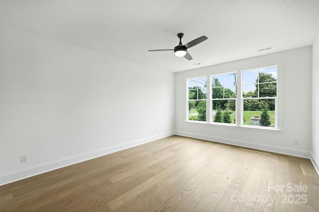 13605 Tranquil Day Dr, Matthews, NC 28105 - empty room with light wood finished floors and a ceiling fan