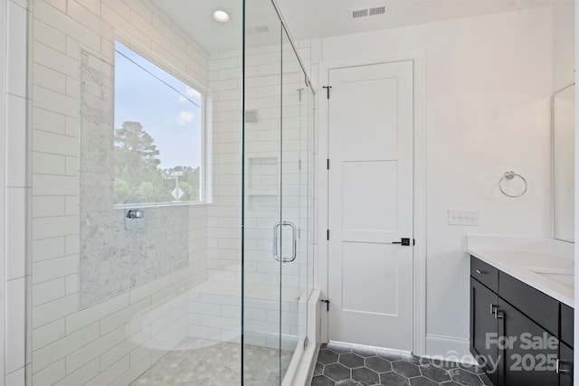 13605 Tranquil Day Dr, Matthews, NC 28105 - bathroom featuring a shower stall, vanity, and tile patterned floors